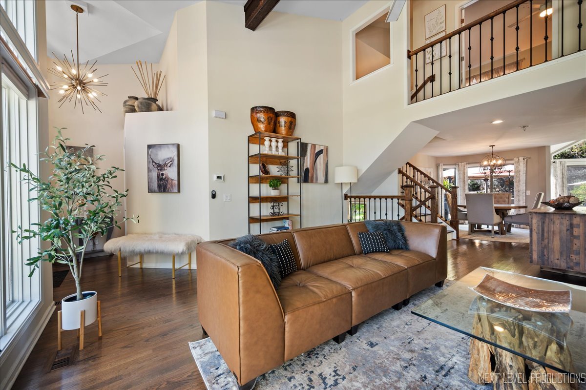 710 Hampton Course West Chicago, IL 60185 - Photo 4 of 28 a living room with furniture and a chandelier