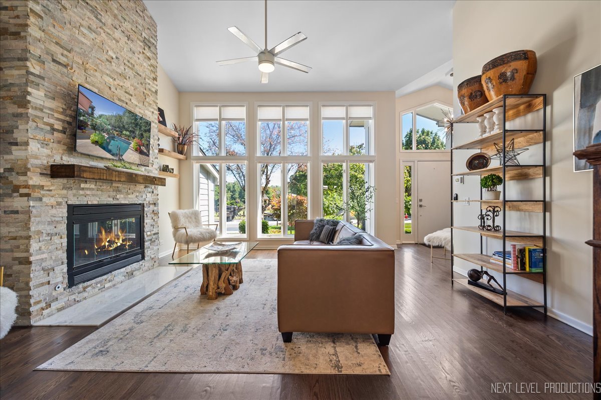 710 Hampton Course West Chicago, IL 60185 - Photo 5 of 28 a living room with furniture fireplace and a flat screen tv