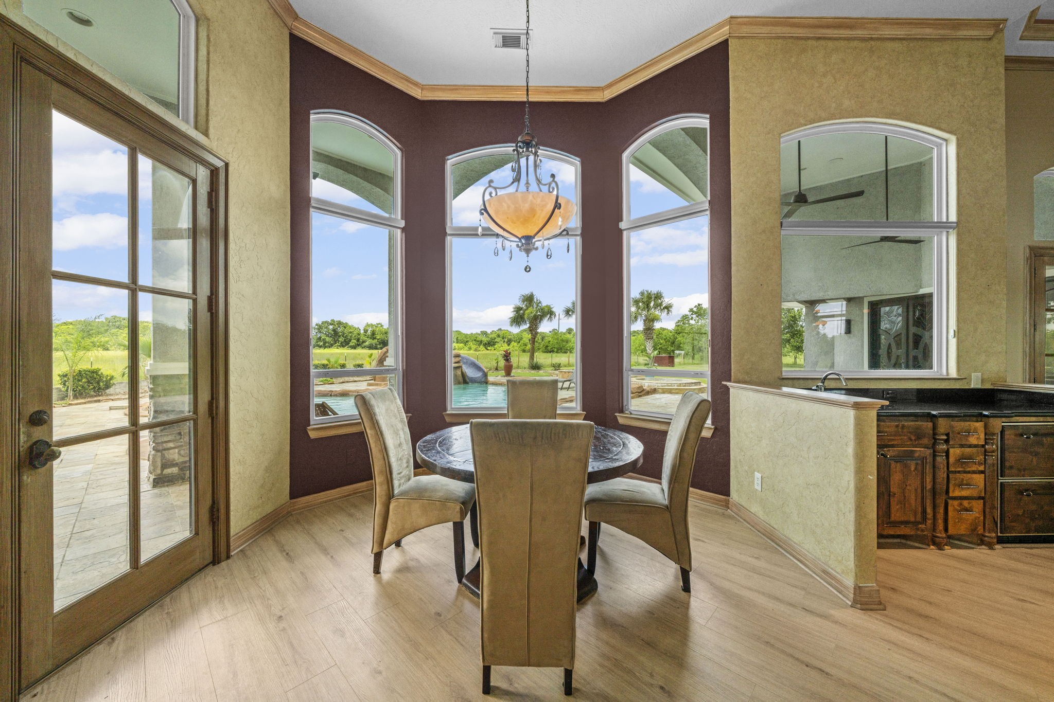 18732 Kz Road Cypress, TX 77433 - Photo 15 of 49 Breathtaking views from every angle, including a bright breakfast nook with a perfect, front-row view of the pool.