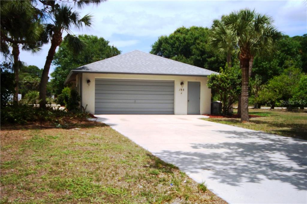 195 North McCall Road Englewood, FL 34223 - Photo 1 of 1 Entrance of McCall Meadows to double driveway