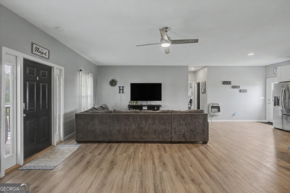 147 Edgar Bell Road Tallapoosa, GA 30176 - Photo 20 of 49 a living room with furniture and a flat screen tv