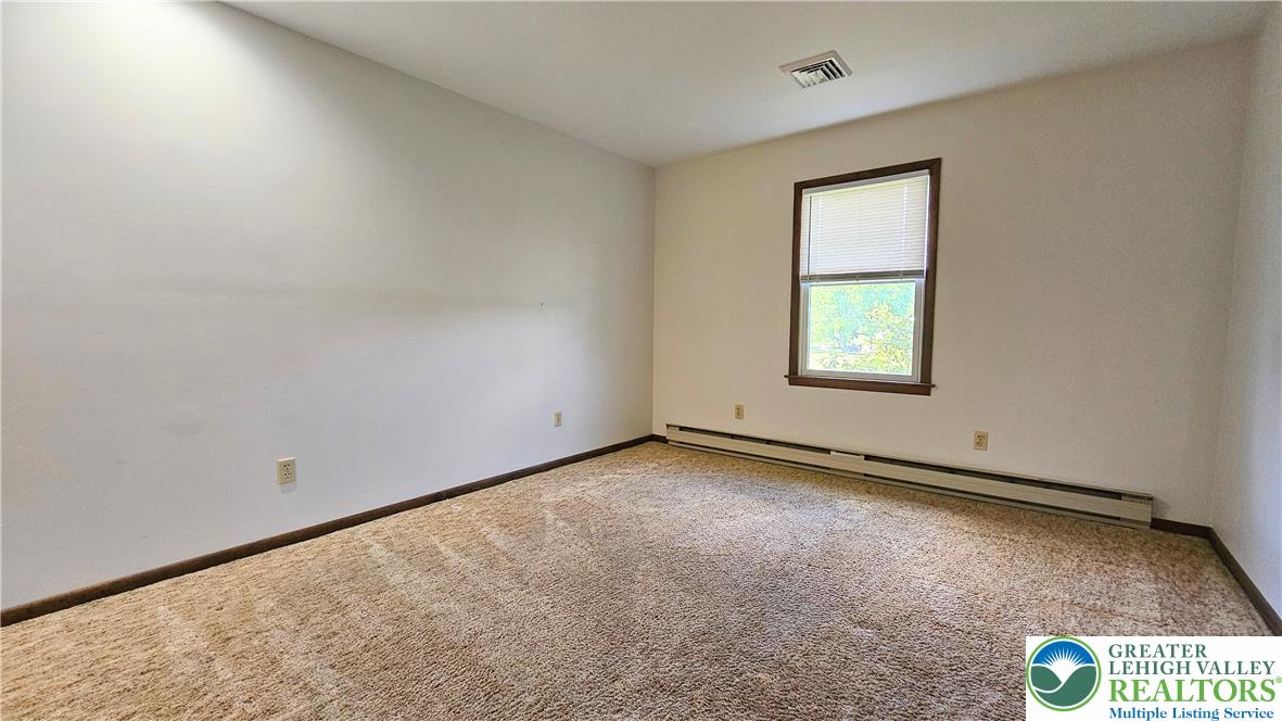 2810 County Line Road Riegelsville, PA 18077 - Photo 2 of 7 A well-lit room awaits your personal touch, offering ample space and natural light.