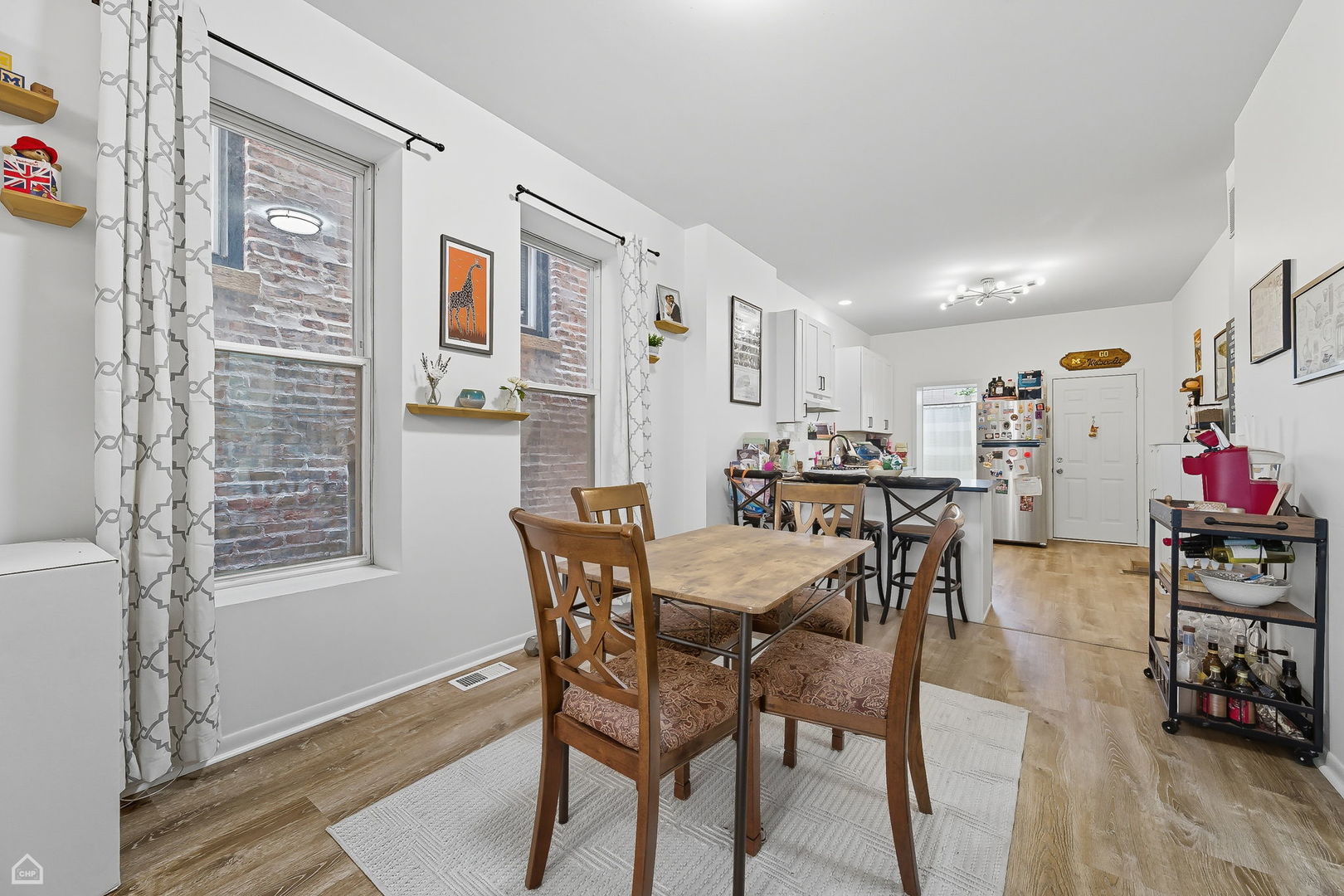 2245 West Erie Street Chicago, IL 60612 - Photo 17 of 25 a view of a dining room with furniture and wooden floor