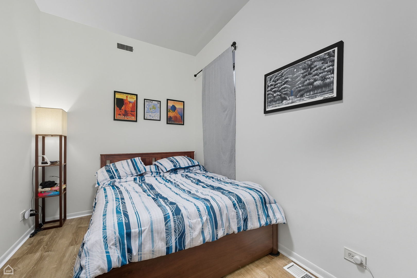 2245 West Erie Street Chicago, IL 60612 - Photo 20 of 25 a bedroom with bed and wooden floor