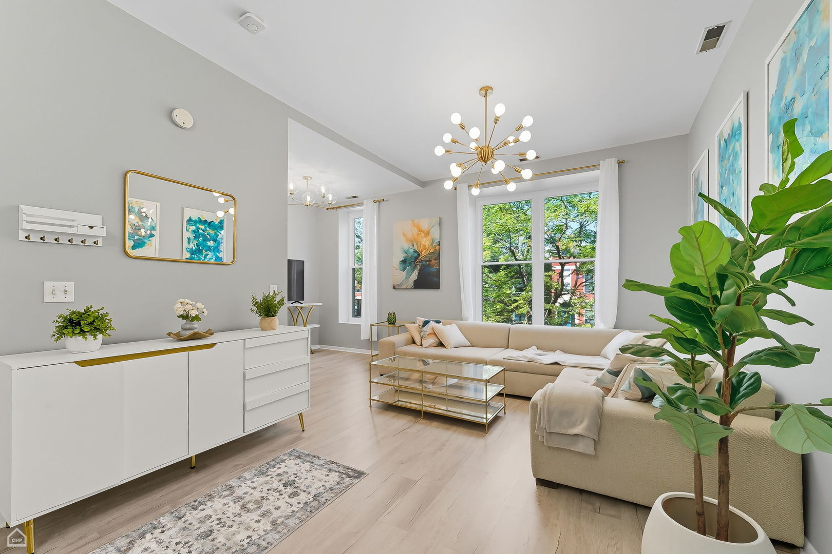 2245 West Erie Street Chicago, IL 60612 - Photo 2 of 25 a living room with furniture and a chandelier