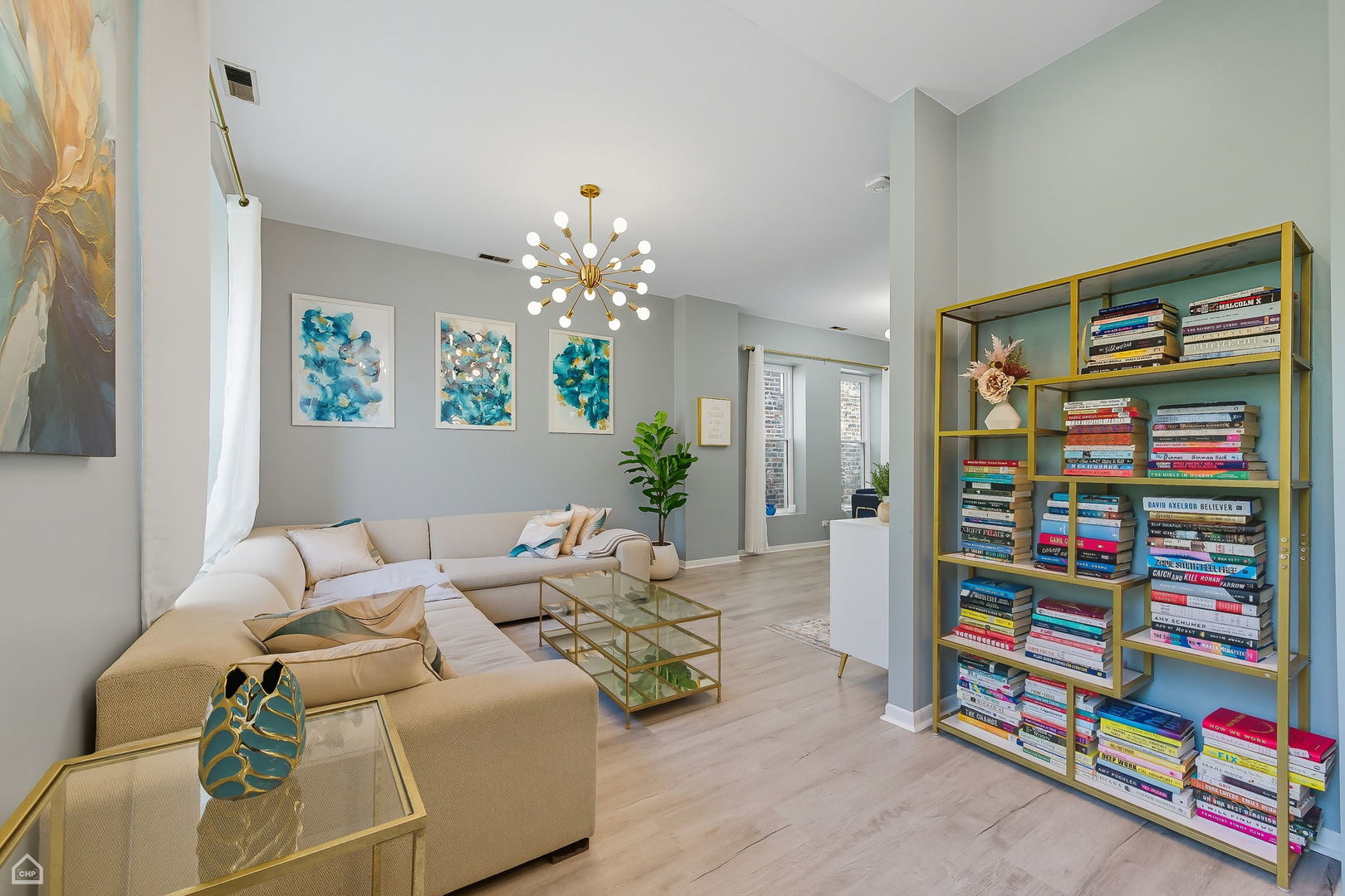 2245 West Erie Street Chicago, IL 60612 - Photo 4 of 25 a living room with furniture and a bookshelf