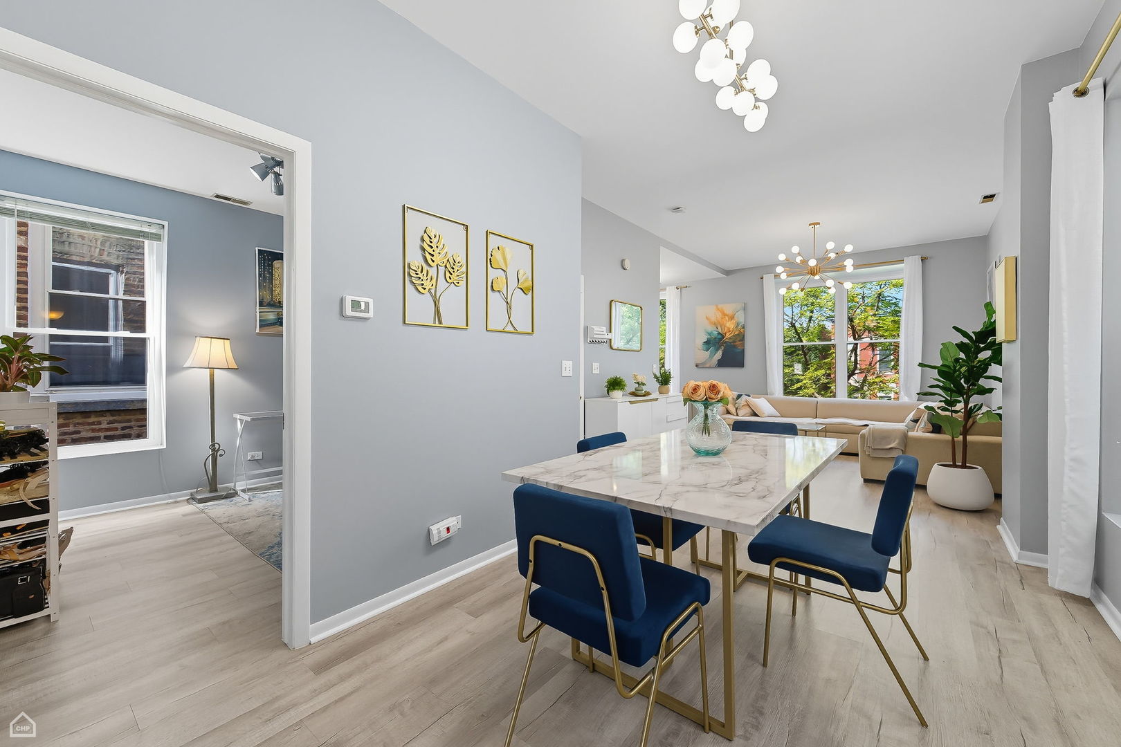 2245 West Erie Street Chicago, IL 60612 - Photo 7 of 25 a view of a dining room with furniture window and wooden floor