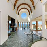 a living room with fireplace furniture and a large window