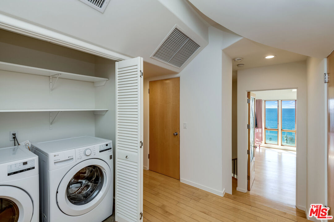 3930 Rambla Orienta Malibu, CA 90265 - Photo 18 of 30 a view of a hallway with washer and dryer