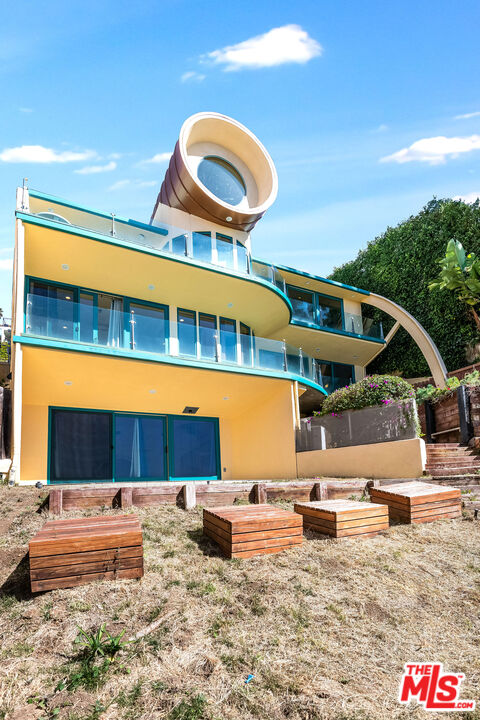 3930 Rambla Orienta Malibu, CA 90265 - Photo 22 of 30 a front view of a house with a yard