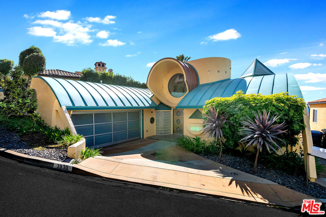 3930 Rambla Orienta Malibu, CA 90265 - Photo 3 of 30 a house view with a garden space