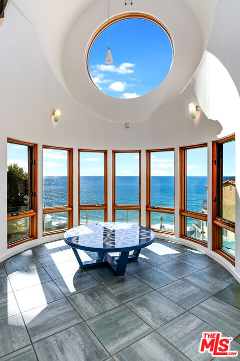 3930 Rambla Orienta Malibu, CA 90265 - Photo 5 of 30 a living room with furniture and a large window