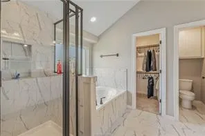 a bathroom with a bathtub and a shower