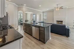 a kitchen with a stove and a sink