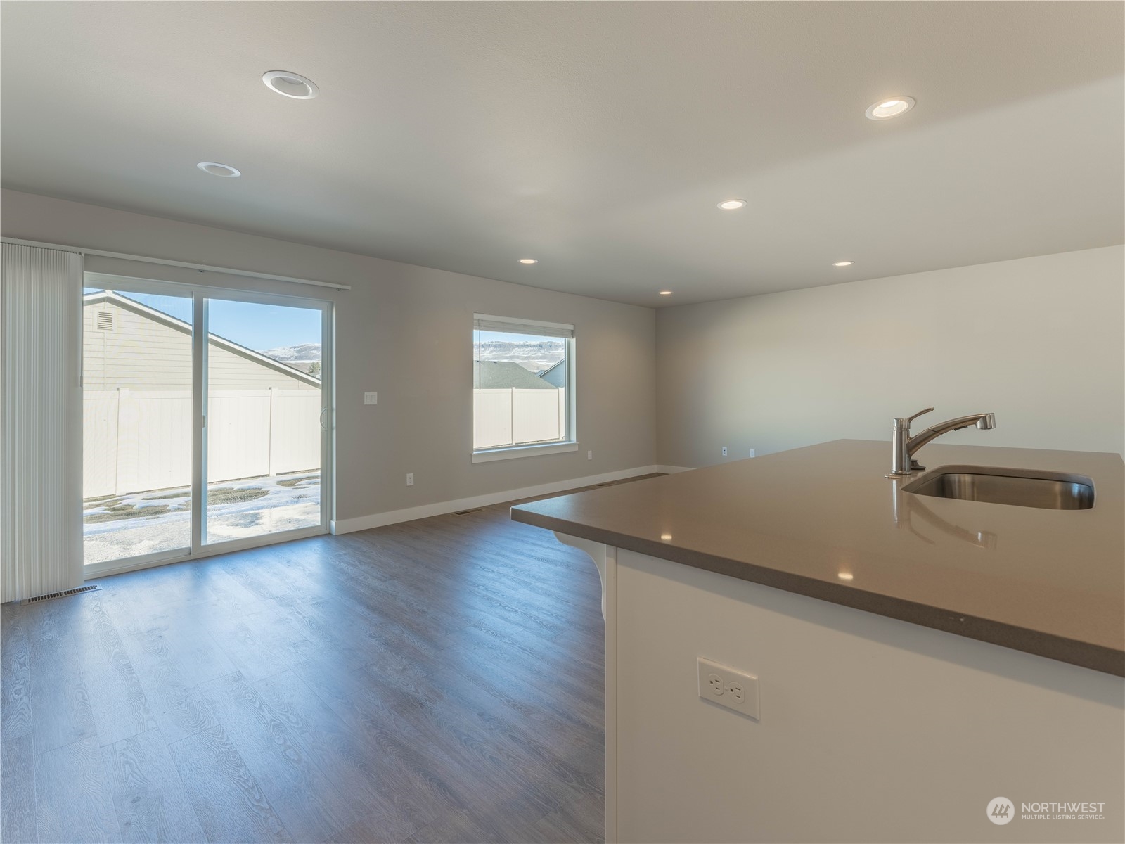 39 South Millbrook Loop East Wenatchee, WA 98802 - Photo 18 of 32 an empty room with wooden floor and windows