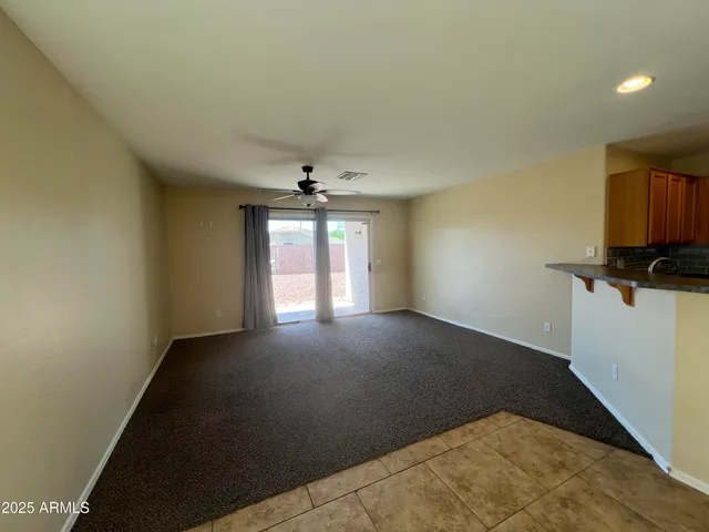 a view of wooden fence and a floor to ceiling window