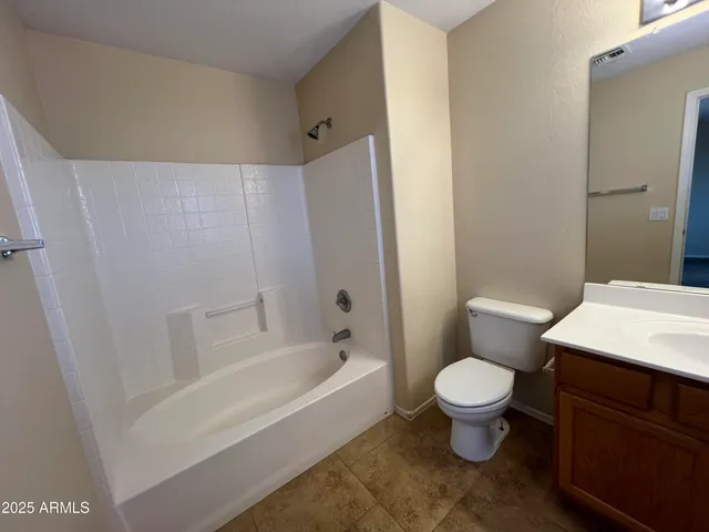 a bathroom with a toilet sink and a bathtub
