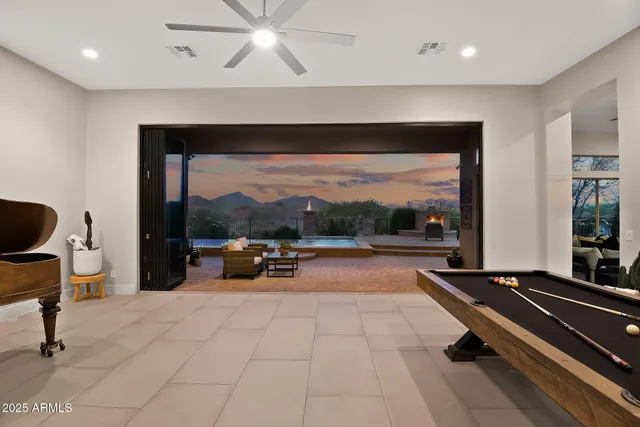a kitchen with stainless steel appliances granite countertop a sink and a refrigerator