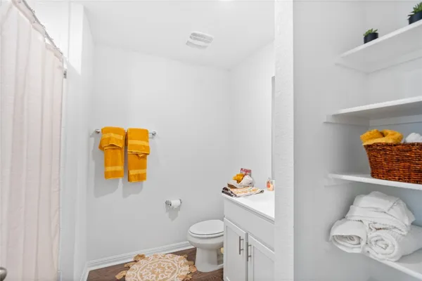 a bathroom with a toilet and a sink