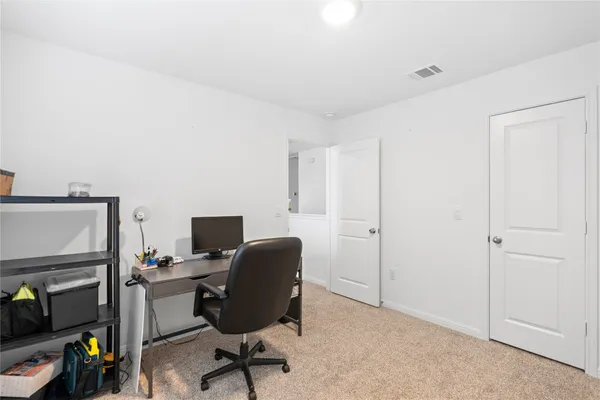 a view of a workspace with furniture