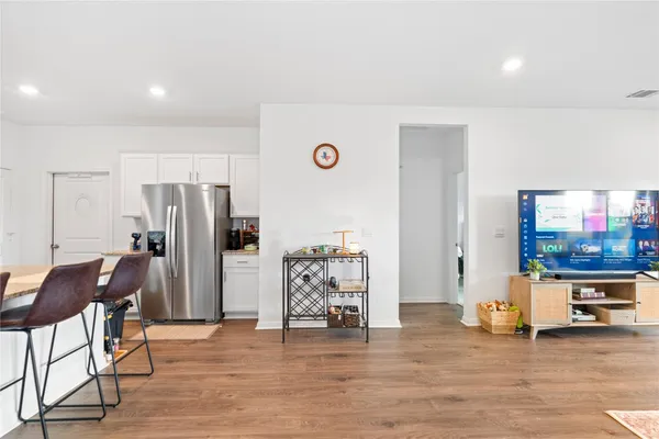 a view of a livingroom with furniture and an empty room