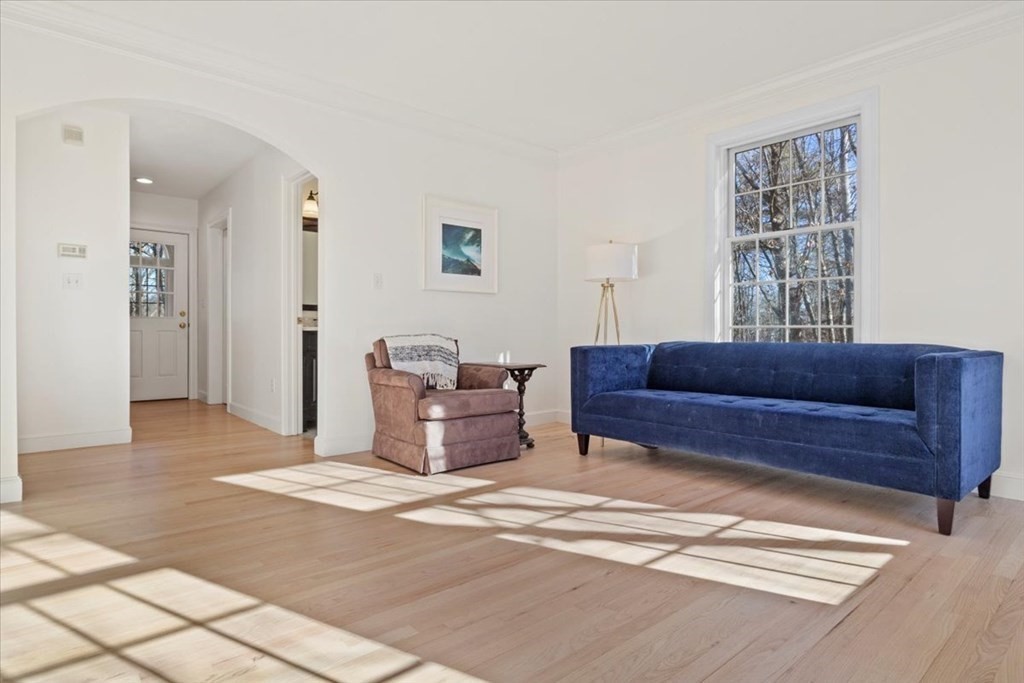 15 Fatherland Drive Newbury, MA 01922 - Photo 16 of 42 a living room with a couch and a window