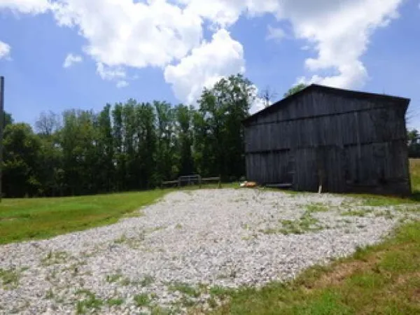 a backyard of a house with wooden fence