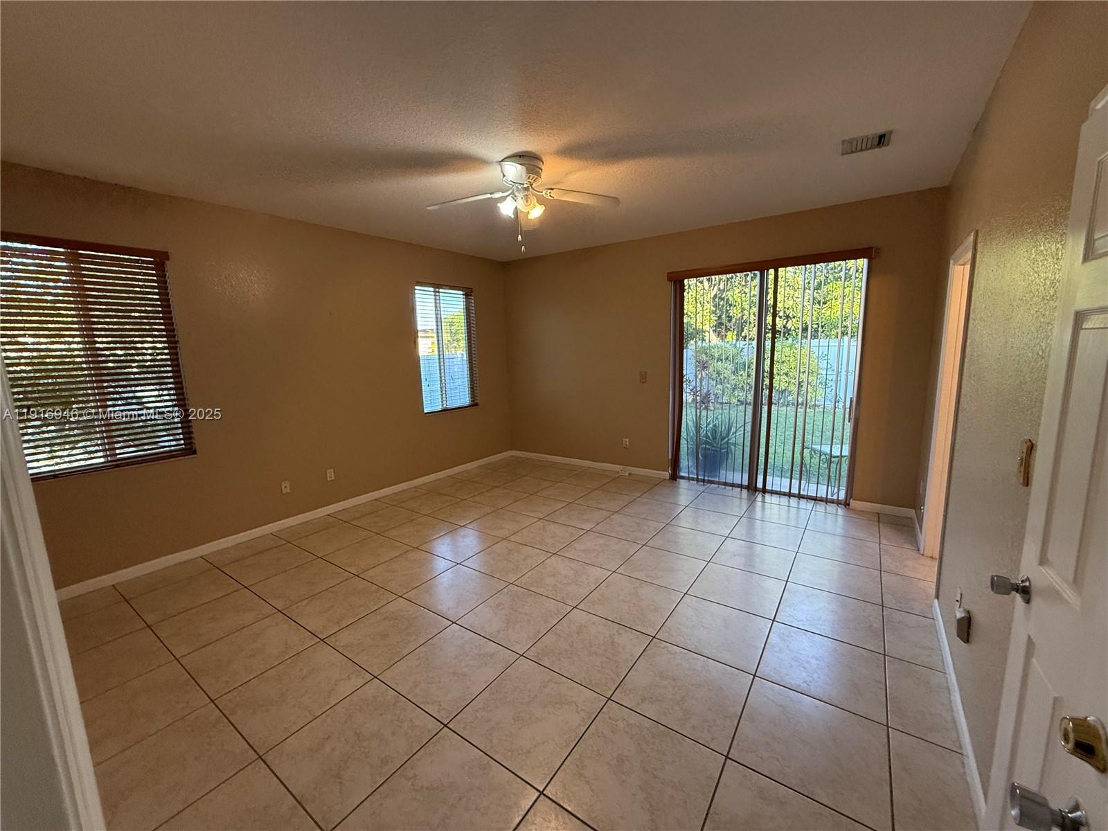 16605 Southwest 103rd Court Miami, FL 33157 - Photo 8 of 28 a view of an empty room with a window