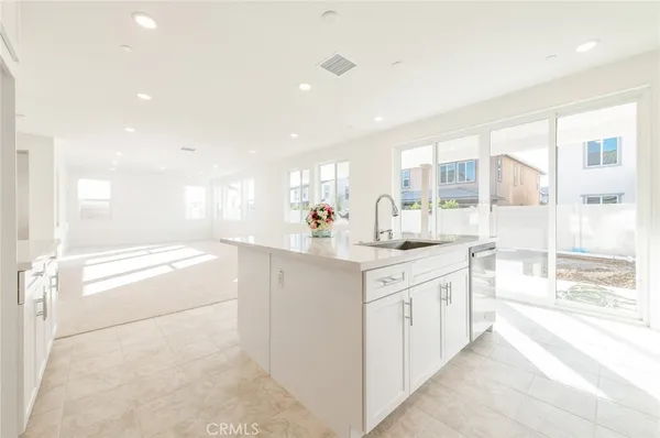 a large bathroom with a large mirror vanity and shower