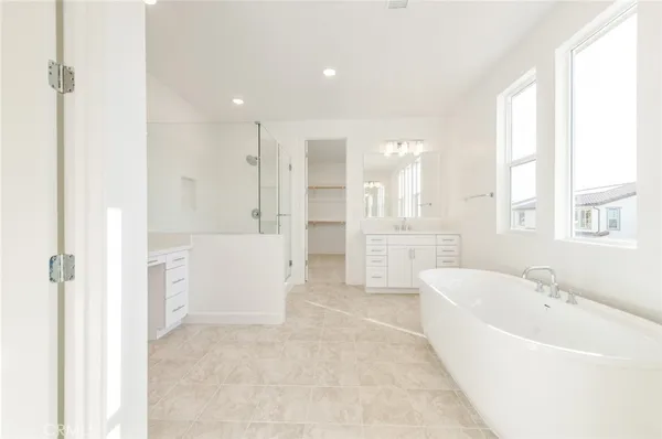 a bathroom with a bathtub and a sink