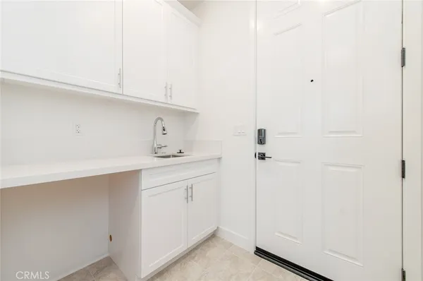 a kitchen with a sink and cabinets