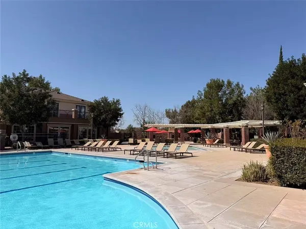 a view of swimming pool with seating space