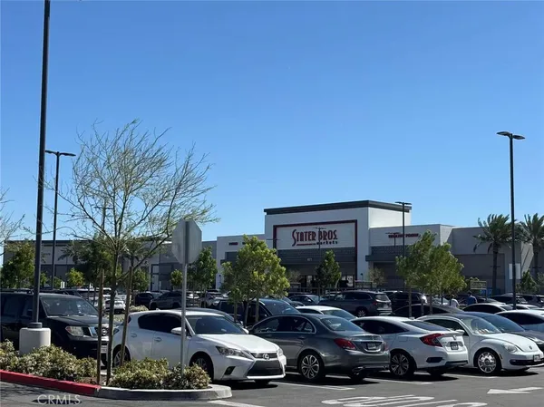 a sign that is sitting on a wooden floor