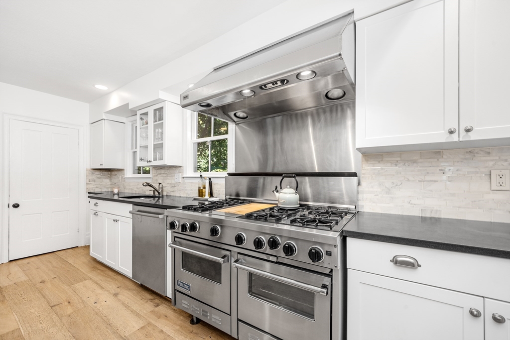 1088 Main Street Hingham, MA 02043 - Photo 11 of 37 a kitchen with stainless steel appliances granite countertop a stove and a sink