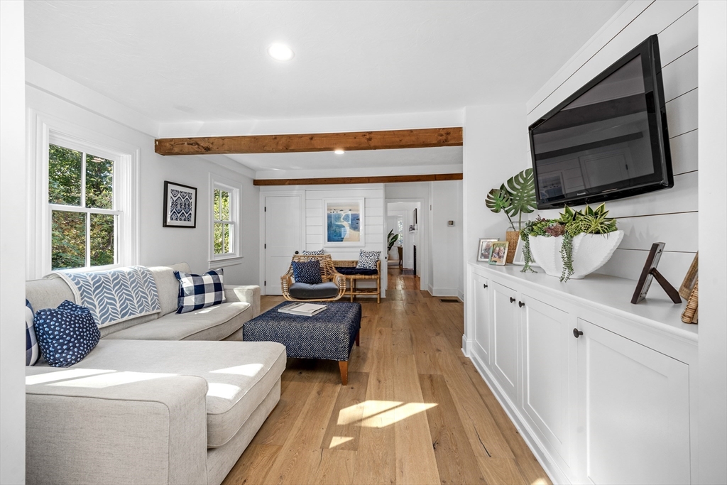 1088 Main Street Hingham, MA 02043 - Photo 14 of 37 a living room with furniture wooden floor and a flat screen tv