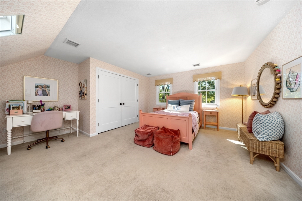1088 Main Street Hingham, MA 02043 - Photo 23 of 37 a bedroom with bed and a chair