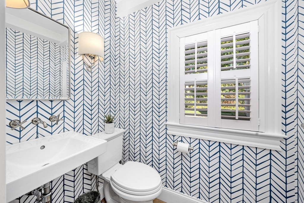 1088 Main Street Hingham, MA 02043 - Photo 28 of 37 a bathroom with a toilet a sink and a mirror