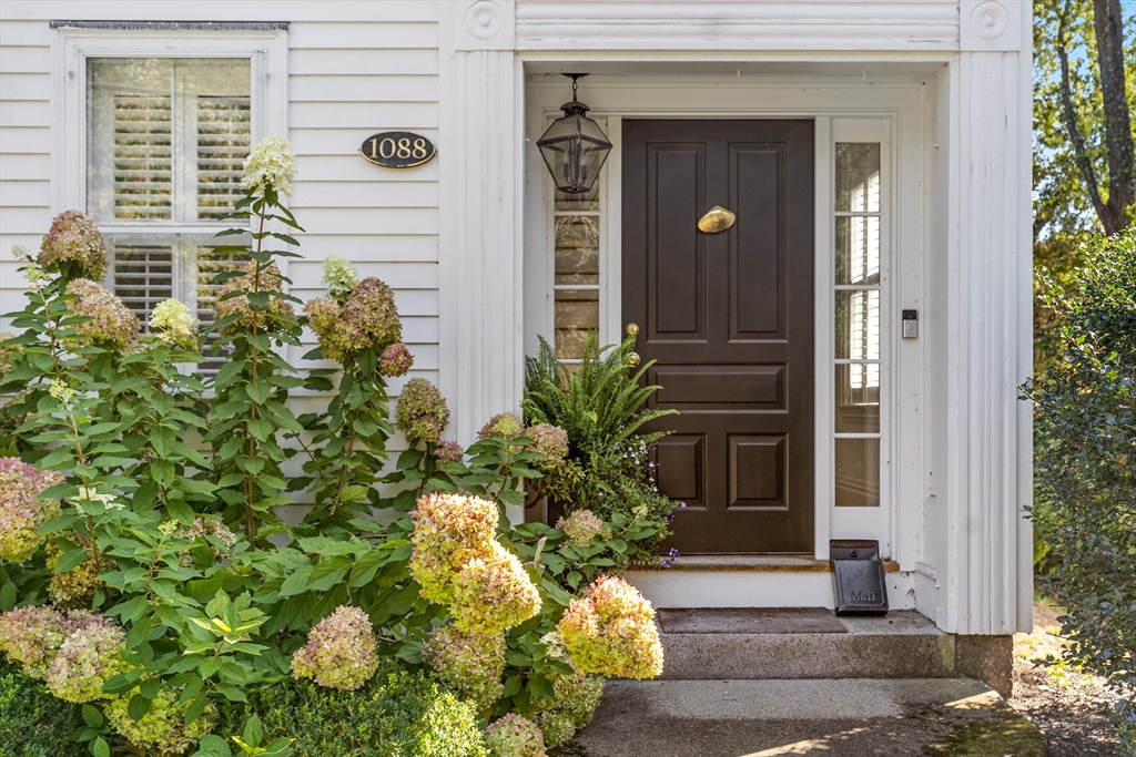1088 Main Street Hingham, MA 02043 - Photo 3 of 37 a front view of a house with a yard