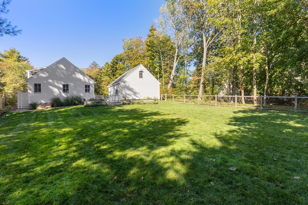 1088 Main Street Hingham, MA 02043 - Photo 35 of 37 a backyard of a house with table and chairs