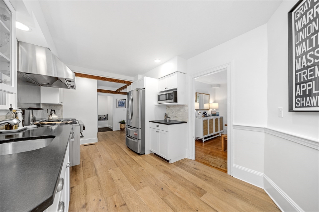1088 Main Street Hingham, MA 02043 - Photo 9 of 37 a kitchen with a refrigerator and a sink
