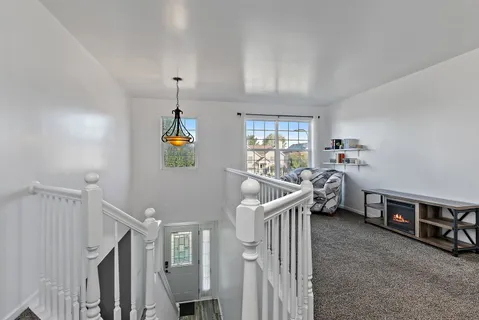a view of a livingroom with furniture and windows