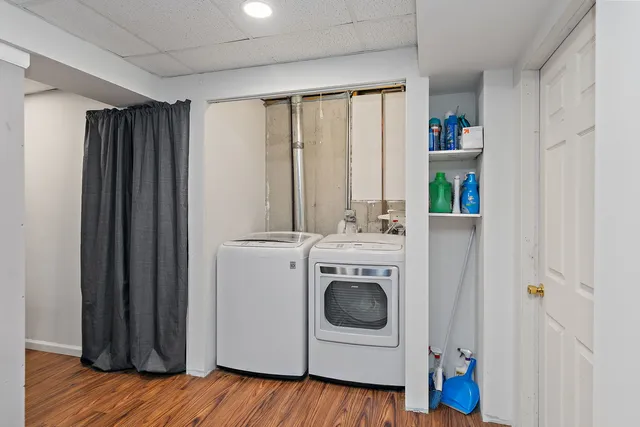 a view of a patio with table and chairs with wooden floor and fence