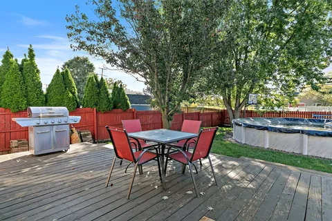 a view of an outdoor sitting area with furniture and backyard