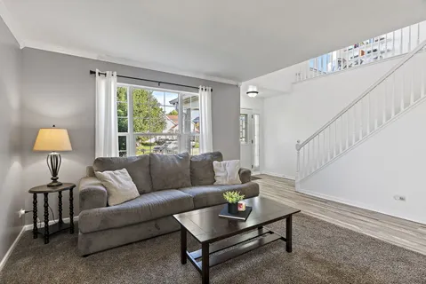 a living room with furniture and a table