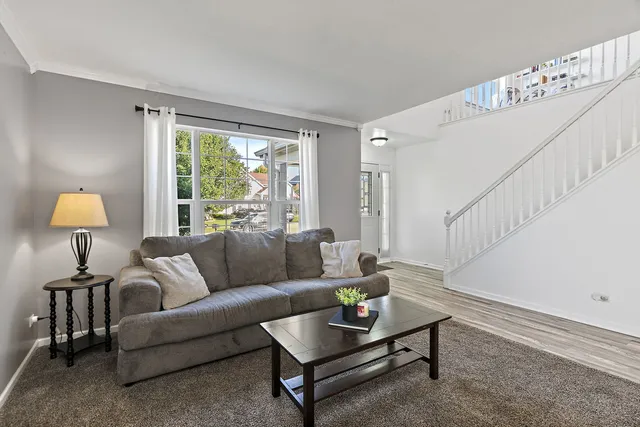 a living room with furniture and a table