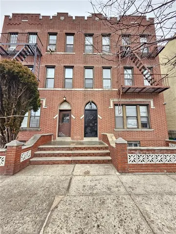 a view of a building with a street