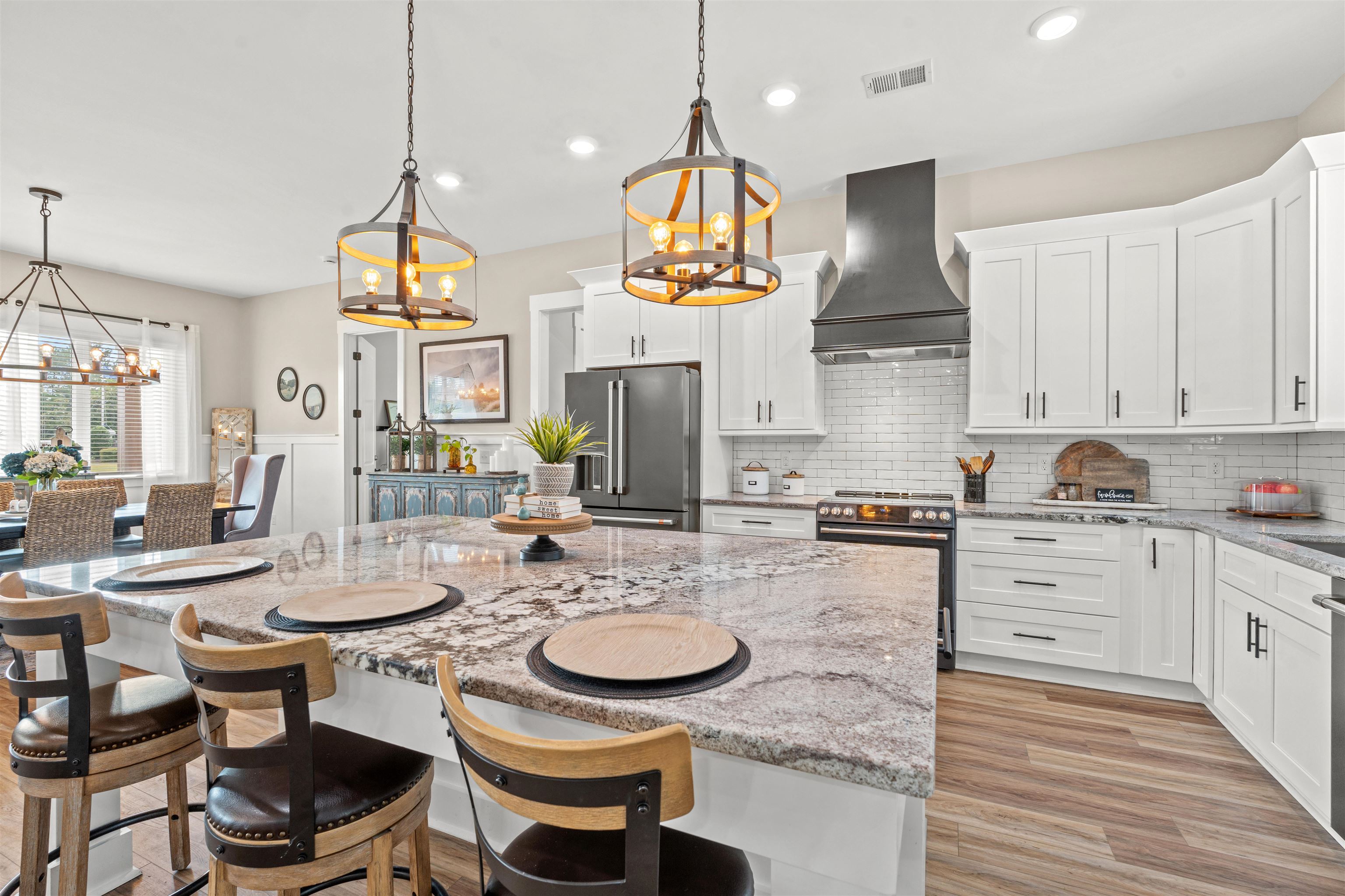 411 Chamberlin Road Myrtle Beach, SC 29588 - Photo 9 of 40 Kitchen featuring a kitchen breakfast bar, light stone counters, white cabinets, pendant lighting, and recessed lighting