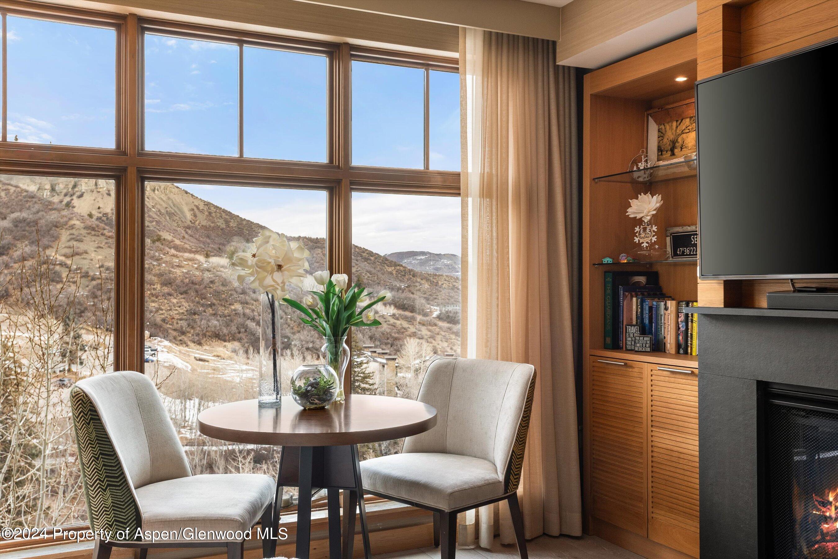 130 Wood Road, Unit 514 Snowmass Village, CO 81615 - Photo 4 of 11 a dining room with furniture window and outside view