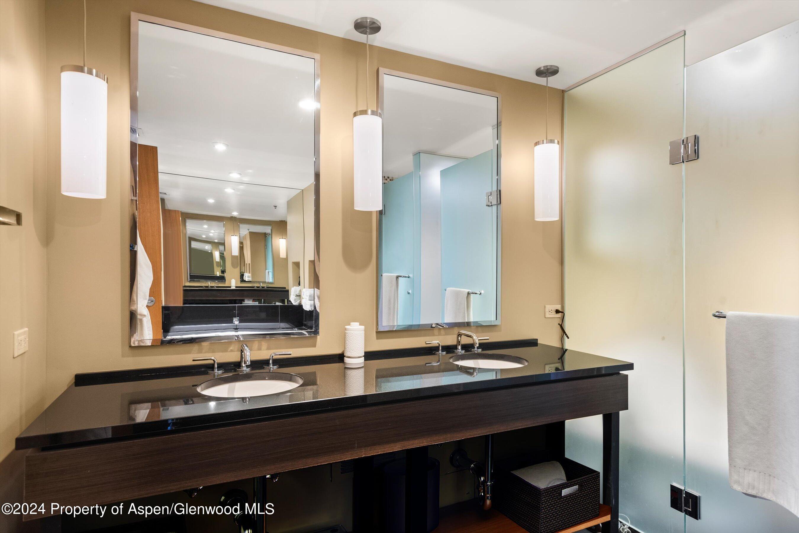 130 Wood Road, Unit 514 Snowmass Village, CO 81615 - Photo 8 of 11 a bathroom with a sink and a mirror