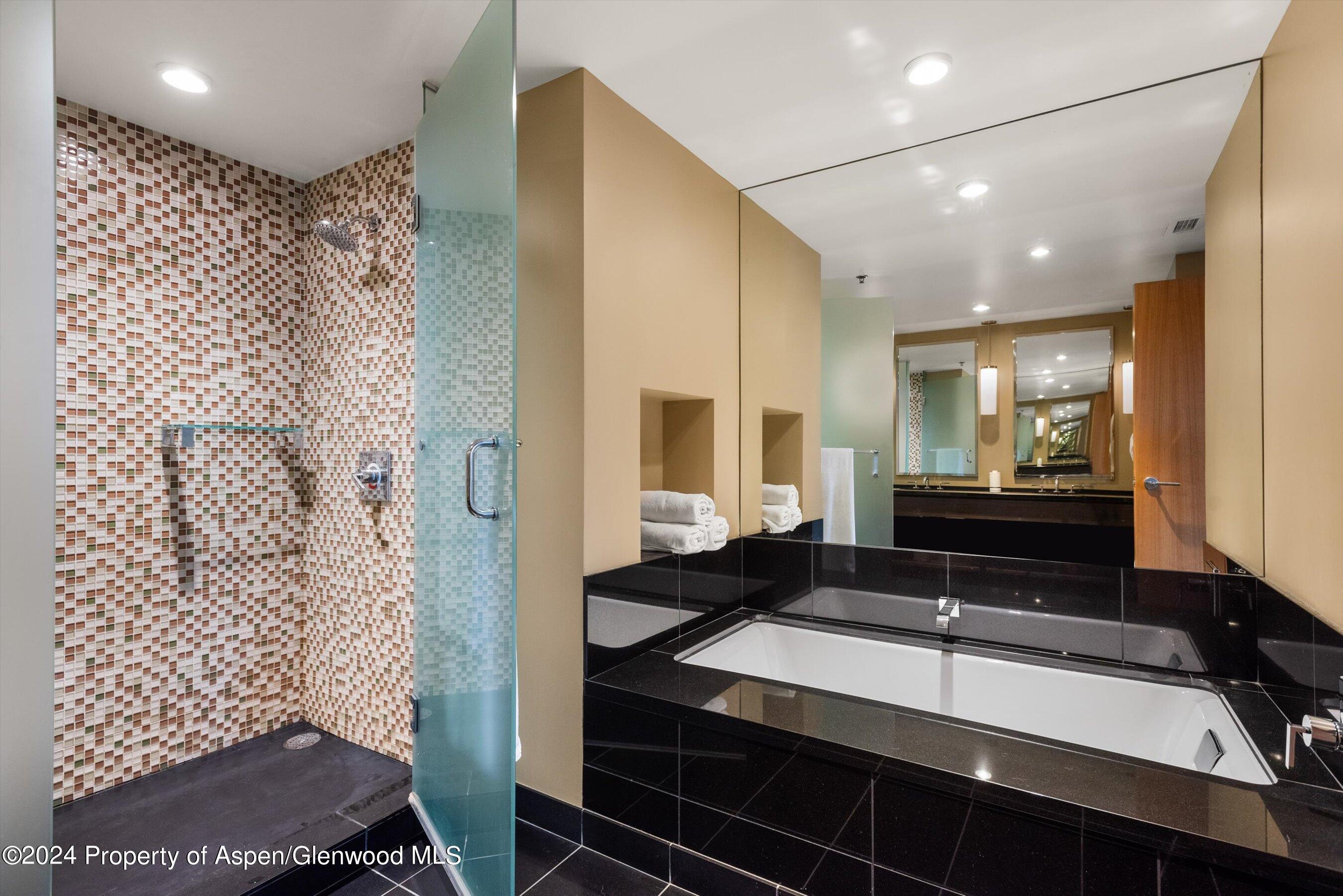 130 Wood Road, Unit 514 Snowmass Village, CO 81615 - Photo 9 of 11 a bathroom with a sink and a mirror